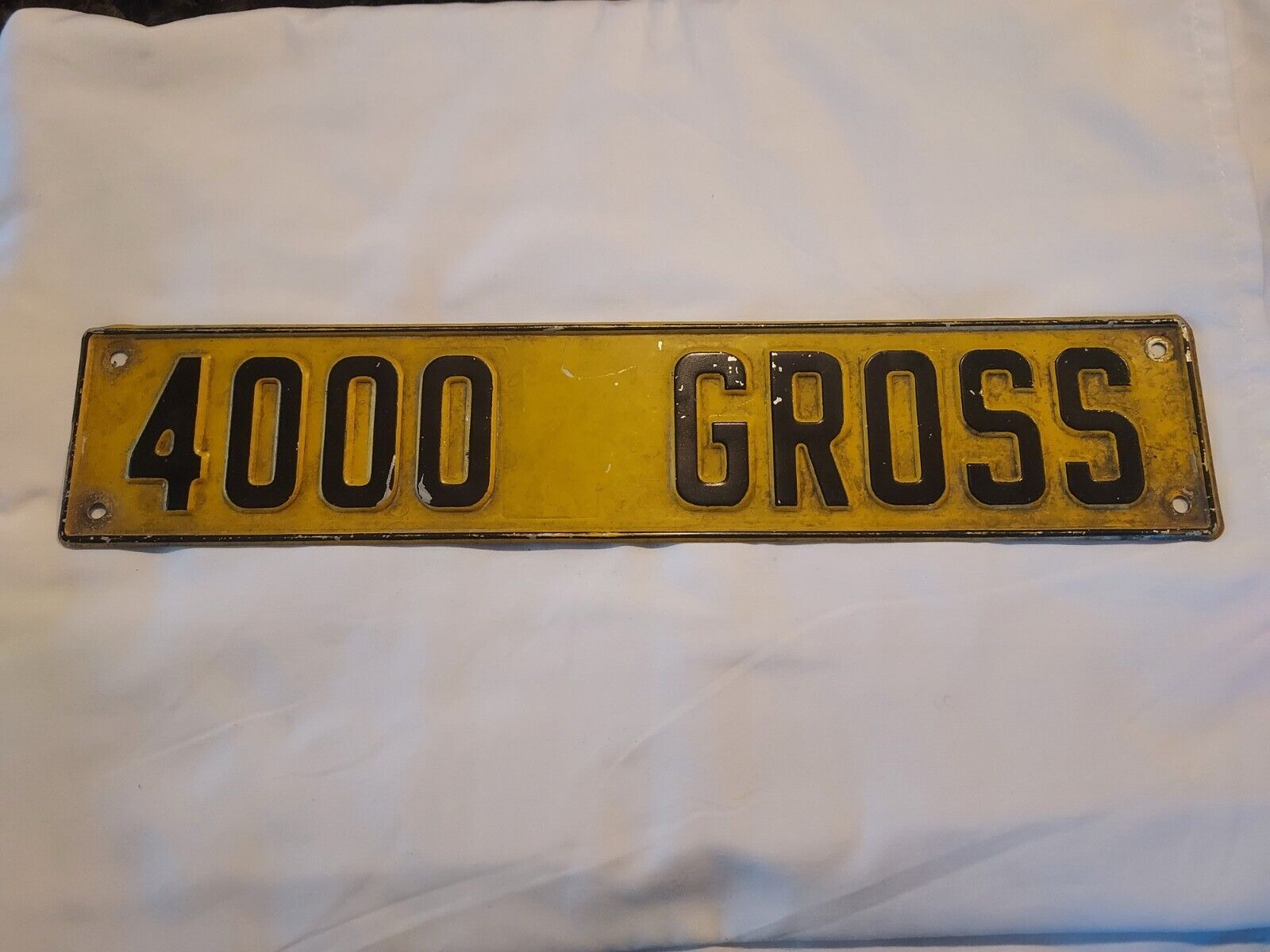 Vintage 4000 Gross Embossed Plate Sign 3 X 14 Inches